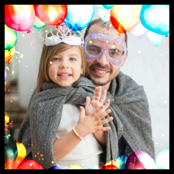 a little girl with her faither, she is dressed up as a princess and surrounded by balloons. one of the best themes for birthday parties in 2025 and beyond is the princess and knight party themes.